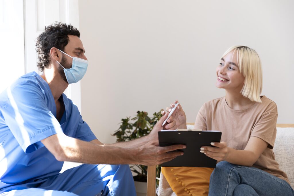 close up person talking with doctor about vaccination 2 1