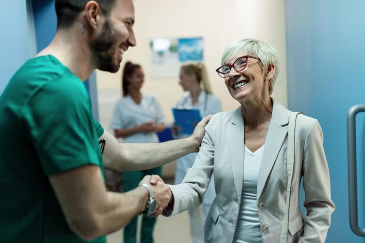 Trusted Professionals at Local Urgent Care Centers imgi 10 happy surgeon senior woman handshaking while greeting lobby clinic focus is woman 637285 644