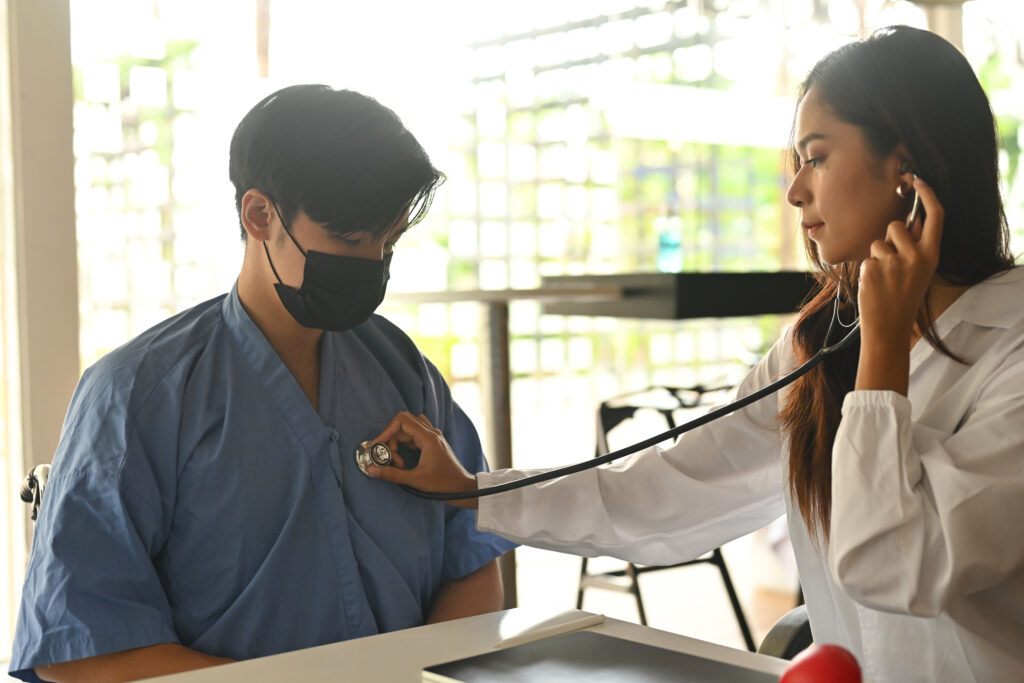 Female Nurse check the chest of male nurse
